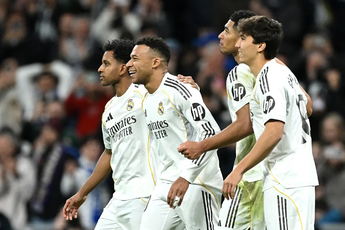 MADRID, SPAIN - DECEMBER 20: Kylian Mbappe of Real Madrid (2L) celebrates scoring his team's second goal with teammates during the LaLiga EA Sports match between Real Madrid CF and Sevilla FC at Estadio Santiago Bernabeu on December 20, 2025 in Madrid, Spain. (Photo by Denis Doyle/Getty Images)