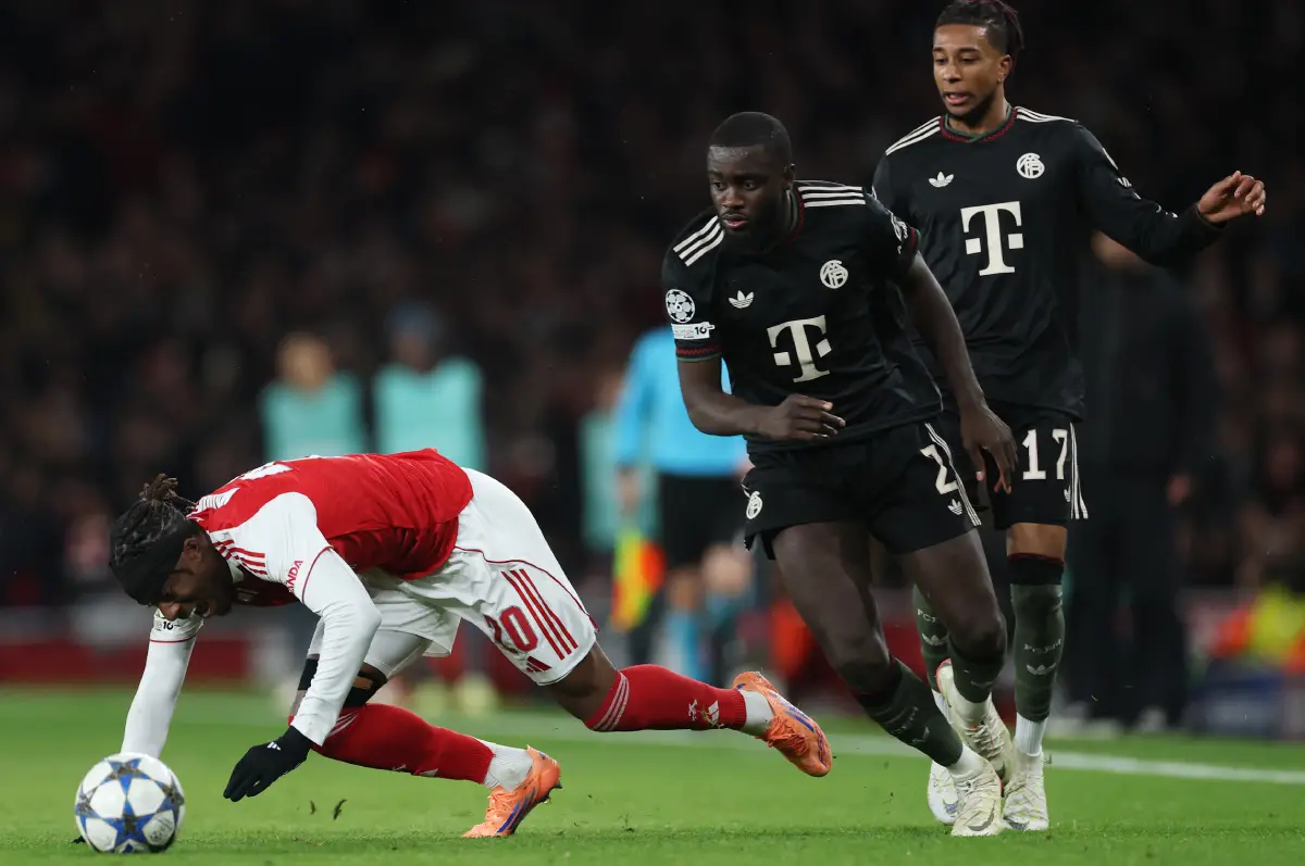 LONDON, ENGLAND - NOVEMBER 26: Noni Madueke of Arsenal is challenged by Dayot Upamecano of Bayern Munich during the UEFA Champions League 2025/26 League Phase MD5 match between Arsenal FC and FC Bayern München at Arsenal Stadium on November 26, 2025 in London, England. (Photo by Richard Heathcote/Getty Images)