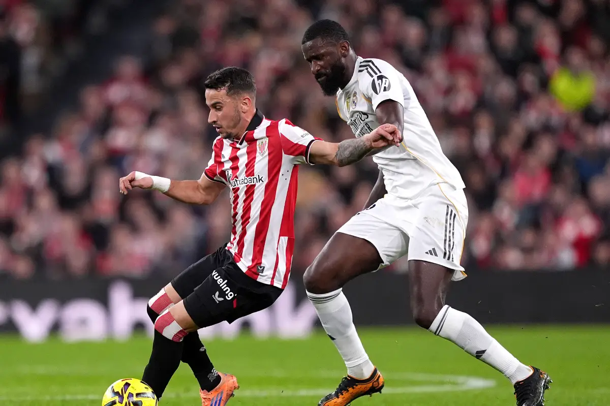 BILBAO, SPAIN - DECEMBER 03: Alex Berenguer of Athletic Club is challenged by Antonio Ruediger of Real Madrid during the LaLiga EA Sports match between Athletic Club and Real Madrid CF at Estadio de San Mames on December 03, 2025 in Bilbao, Spain. (Photo by Juan Manuel Serrano Arce/Getty Images)