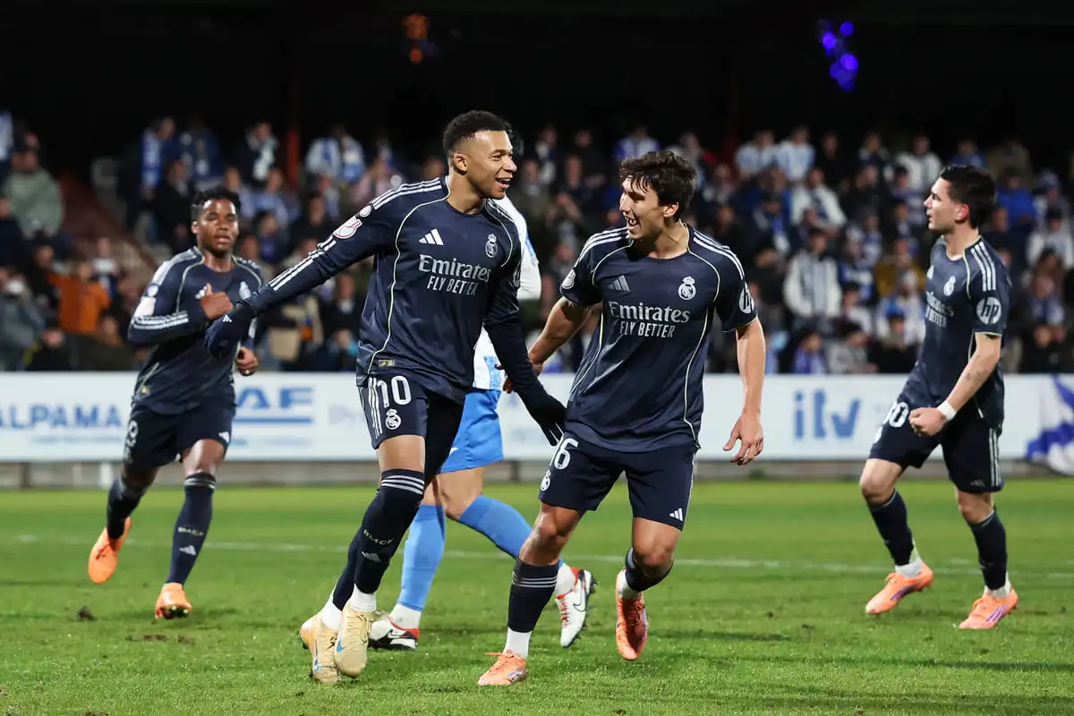 TALAVERA DE LA REINA, SPAIN - DECEMBER 17: Kylian Mbappe of Real Madrid celebrates scoring his team's first goal with teammate Gonzalo Garcia during the Copa del Rey match between CF Talavera and Real Madrid at Estadio El Prado on December 17, 2025 in Talavera de la Reina, Spain. (Photo by Florencia Tan Jun/Getty Images).