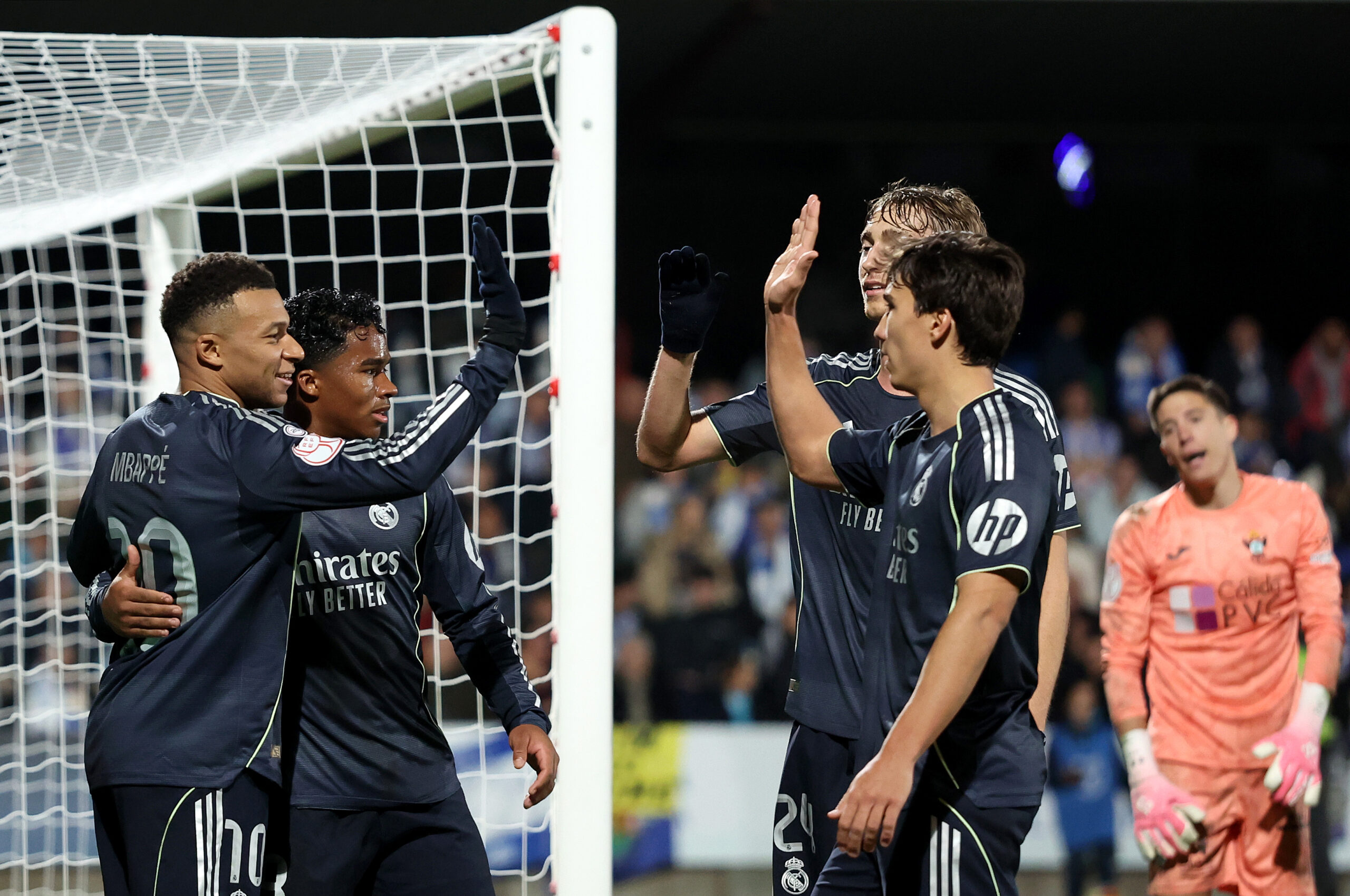 TALAVERA DE LA REINA, SPAIN - DECEMBER 17: Kylian Mbappe of Real Madrid celebrates scoring his team's first goal with teammates during the Copa del Rey match between CF Talavera and Real Madrid at Estadio El Prado on December 17, 2025 in Talavera de la Reina, Spain. (Photo by Florencia Tan Jun/Getty Images)