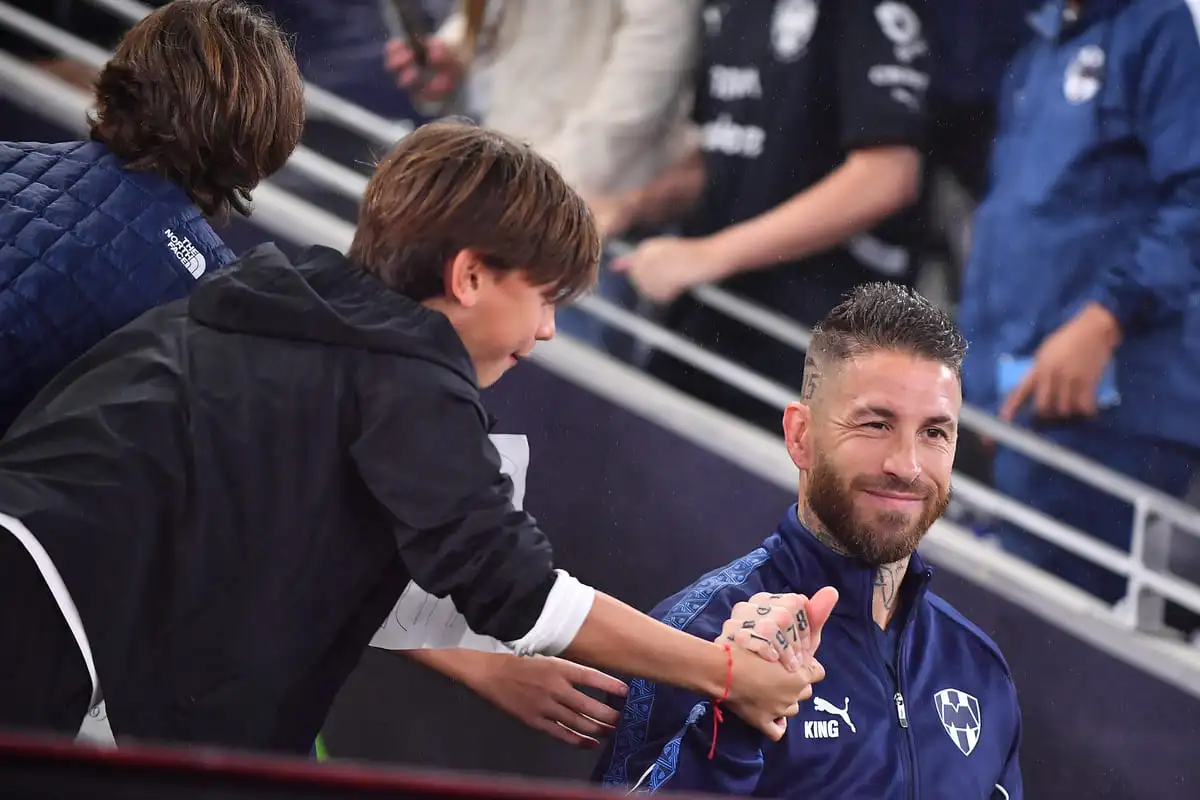 MONTERREY, MEXICO - NOVEMBER 26: Sergio Ramos of Monterrey shake hands with a fan during the quarterfinals first leg match between Monterrey and America as part of the Torneo Apertura 2025 Liga MX at BBVA Stadium on November 26, 2025 in Monterrey, Mexico. (Photo by Azael Rodriguez/Getty Images)