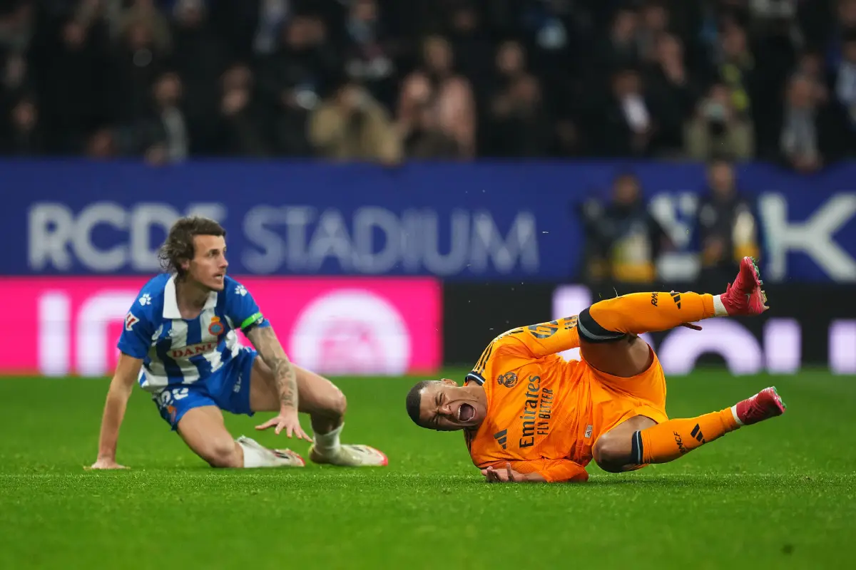 BARCELONA, SPAIN - FEBRUARY 01: Kylian Mbappe of Real Madrid goes down after being challenged by Carlos Romero of RCD Espanyol (obscured) during the LaLiga match between RCD Espanyol de Barcelona and Real Madrid CF at RCDE Stadium on February 01, 2025 in Barcelona, Spain. (Photo by Alex Caparros/Getty Images)