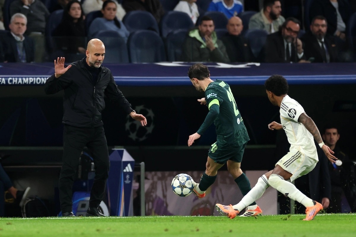MADRID, SPAIN - DECEMBER 10: Pep Guardiola, Manager of Manchester City, reacts as Bernardo Silva of Manchester City controls the ball during the UEFA Champions League 2025/26 League Phase MD6 match between Real Madrid C.F. and Manchester City at Estadio Santiago Bernabeu on December 10, 2025 in Madrid, Spain. (Photo by Florencia Tan Jun/Getty Images)