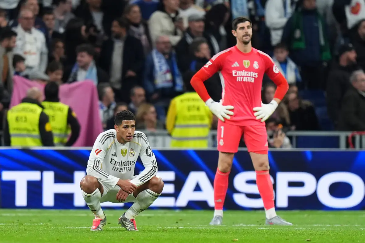 MADRID, SPAIN - DECEMBER 07: Jude Bellingham and Thibaut Courtois of Real Madrid look dejected following defeat in the LaLiga EA Sports match between Real Madrid CF and RC Celta de Vigo at Estadio Santiago Bernabeu on December 07, 2025 in Madrid, Spain. (Photo by Angel Martinez/Getty Images)