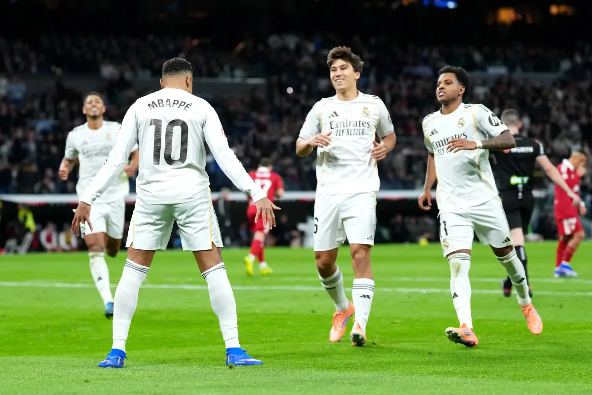 MADRID, SPAIN - DECEMBER 20: Kylian Mbappe of Real Madrid celebrates scoring his team's second goal with teammates during the LaLiga EA Sports match between Real Madrid CF and Sevilla FC at Estadio Santiago Bernabeu on December 20, 2025 in Madrid, Spain. (Photo by Angel Martinez/Getty Images)