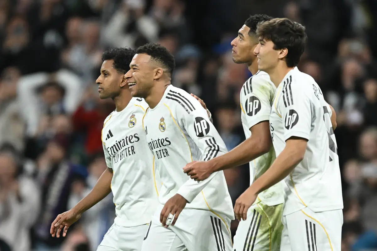 MADRID, SPAIN - DECEMBER 20: Kylian Mbappe of Real Madrid (R) celebrates scoring his team's second goal with teammates Rodrygo (L) Jude Bellingham (C) and Gonzalo Garcia during the LaLiga EA Sports match between Real Madrid CF and Sevilla FC at Estadio Santiago Bernabeu on December 20, 2025 in Madrid, Spain. (Photo by Denis Doyle/Getty Images)