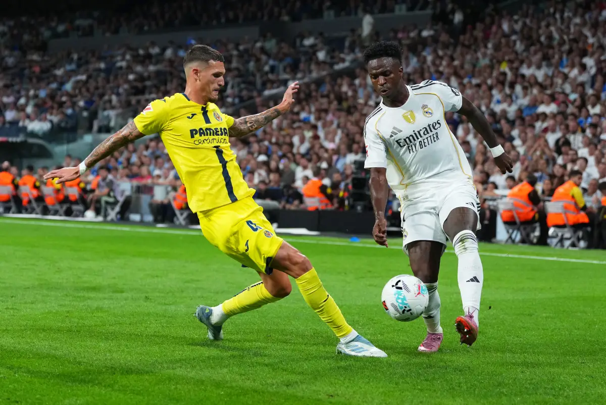 MADRID, SPAIN - OCTOBER 04: Vinicius Junior of Real Madrid is challenged by Rafa Marin of Villarreal CF during the LaLiga EA Sports match between Real Madrid CF and Villarreal CF at Estadio Santiago Bernabeu on October 04, 2025 in Madrid, Spain. (Photo by Angel Martinez/Getty Images)