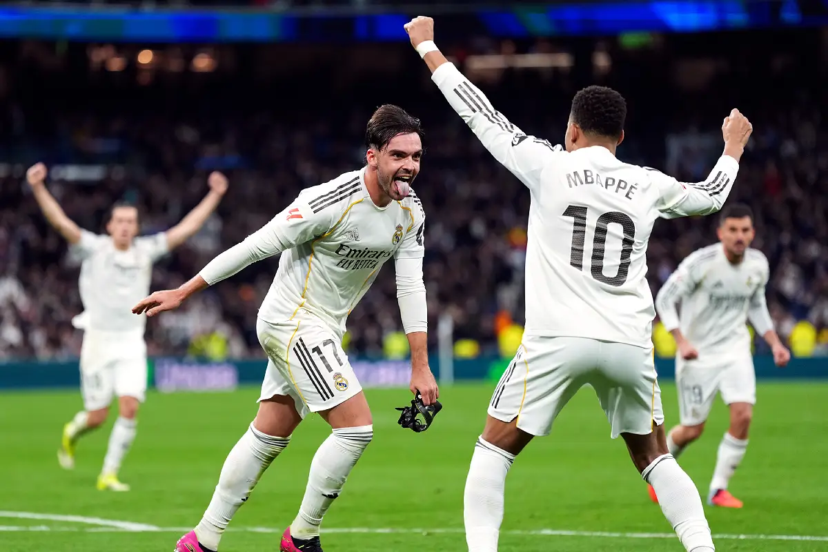 MADRID, SPAIN - JANUARY 17: Raul Asencio of Real Madrid (L) celebrates scoring his team's second goal with teammate Kylian Mbappe (R) during the LaLiga EA Sports match between Real Madrid CF and Levante UD at Estadio Santiago Bernabeu on January 17, 2026 in Madrid, Spain. (Photo by Angel Martinez/Getty Images)