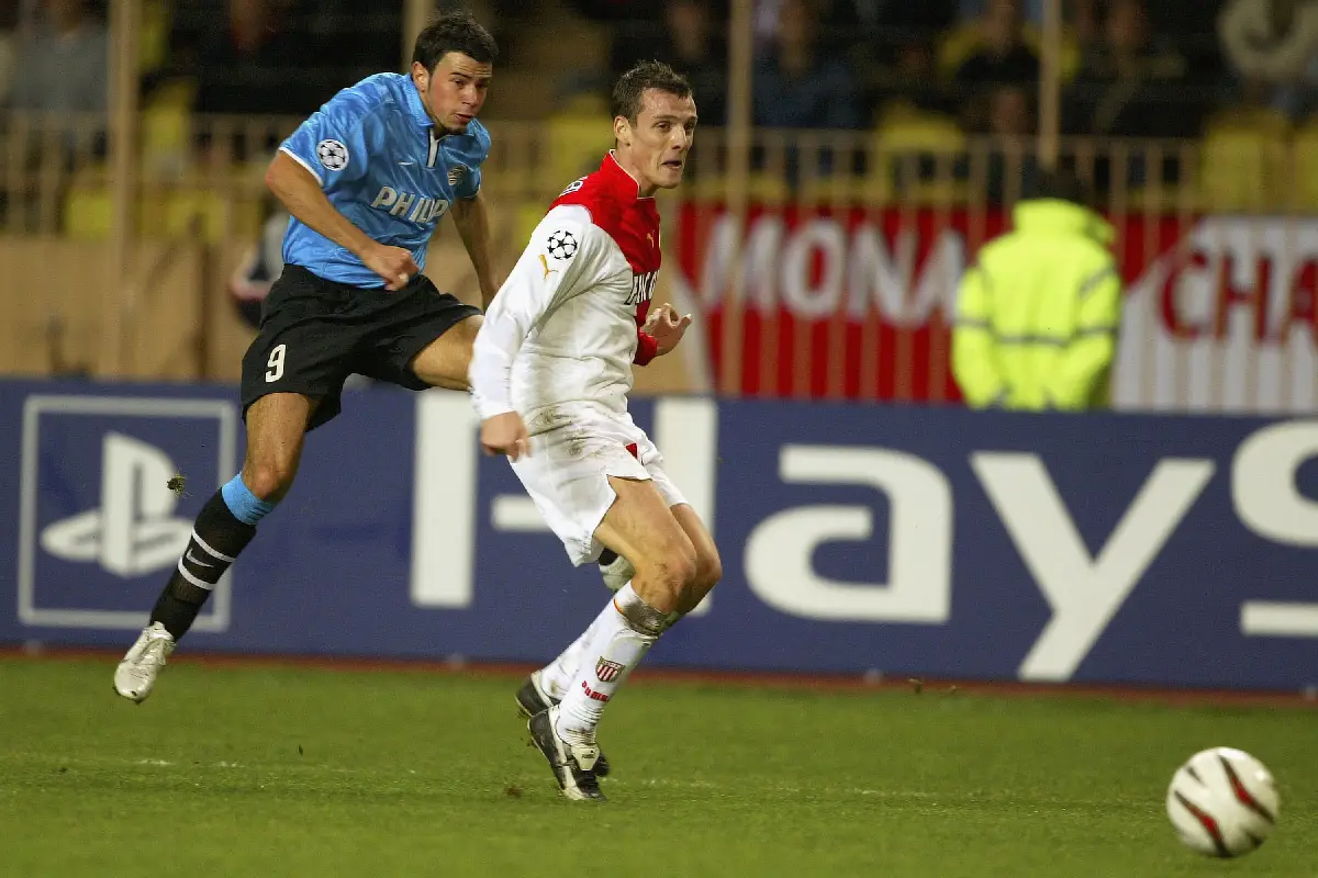 MONACO - NOVEMBER 25: Mateja Kezman of Eindhoven battles for the ball with Sebastien Squillaci of Monaco during the UEFA Champions League Group stage match between Monaco and PSV Eindhoven at the Louis II Stadium on November 25, 2003 in Monaco. (Photo by Pascal Le Segretain/Getty Images)