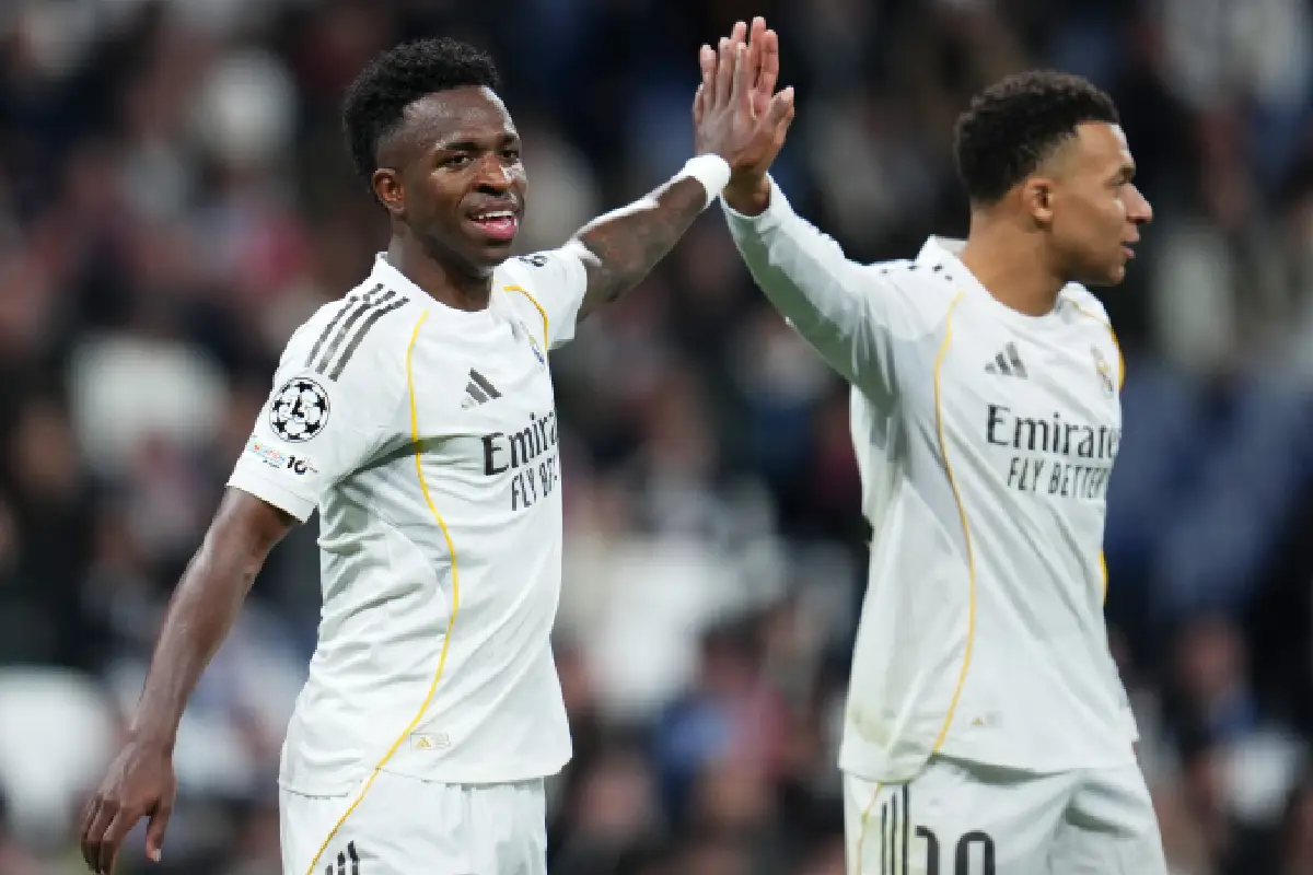 MADRID, SPAIN - JANUARY 20: Vinicius Junior of Real Madrid reacts with Kylian Mbappe during the UEFA Champions League 2025/26 League Phase MD7 match between Real Madrid C.F. and AS Monaco at Estadio Santiago Bernabeu on January 20, 2026 in Madrid, Spain. (Photo by Aitor Alcalde/Getty Images)