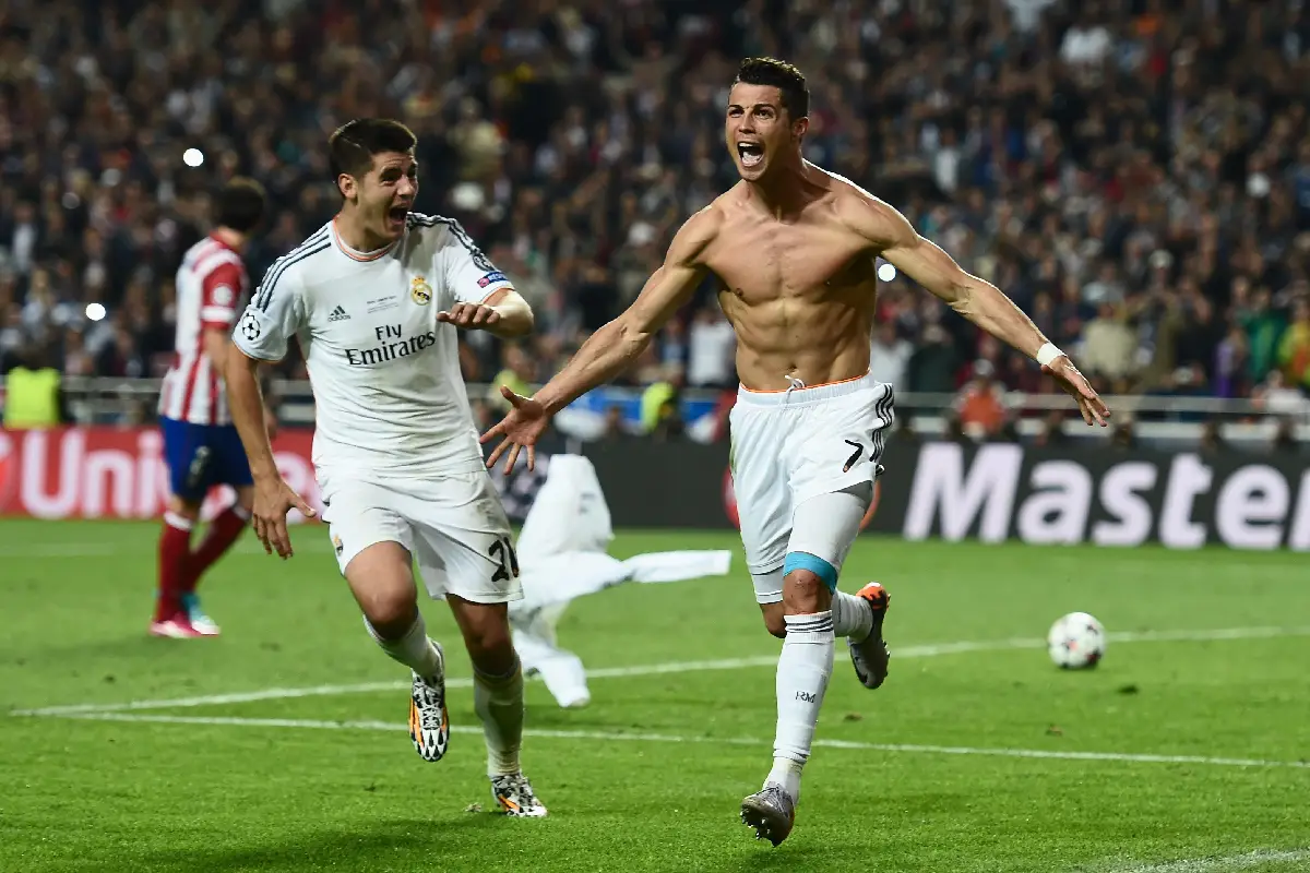 LISBON, PORTUGAL - MAY 24: Cristiano Ronaldo of Real Madrid celebrates after scoring their fourth goal from the penalty spot during the UEFA Champions League Final between Real Madrid and Atletico de Madrid at Estadio da Luz on May 24, 2014 in Lisbon, Portugal. (Photo by Shaun Botterill/Getty Images)