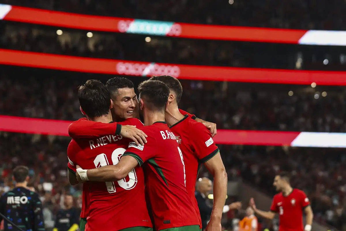 LISBON, PORTUGAL - SEPTEMBER 8: Cristiano Ronaldo of Portugal celebrates with his teammates after scoring Portugal´s during the UEFA Nations League 2024/25 League A Group A1 match between Portugal and Scotland at Estadio da Luz on September 8, 2024 in Lisbon, Portugal. (Photo by Carlos Rodrigues/Getty Images).