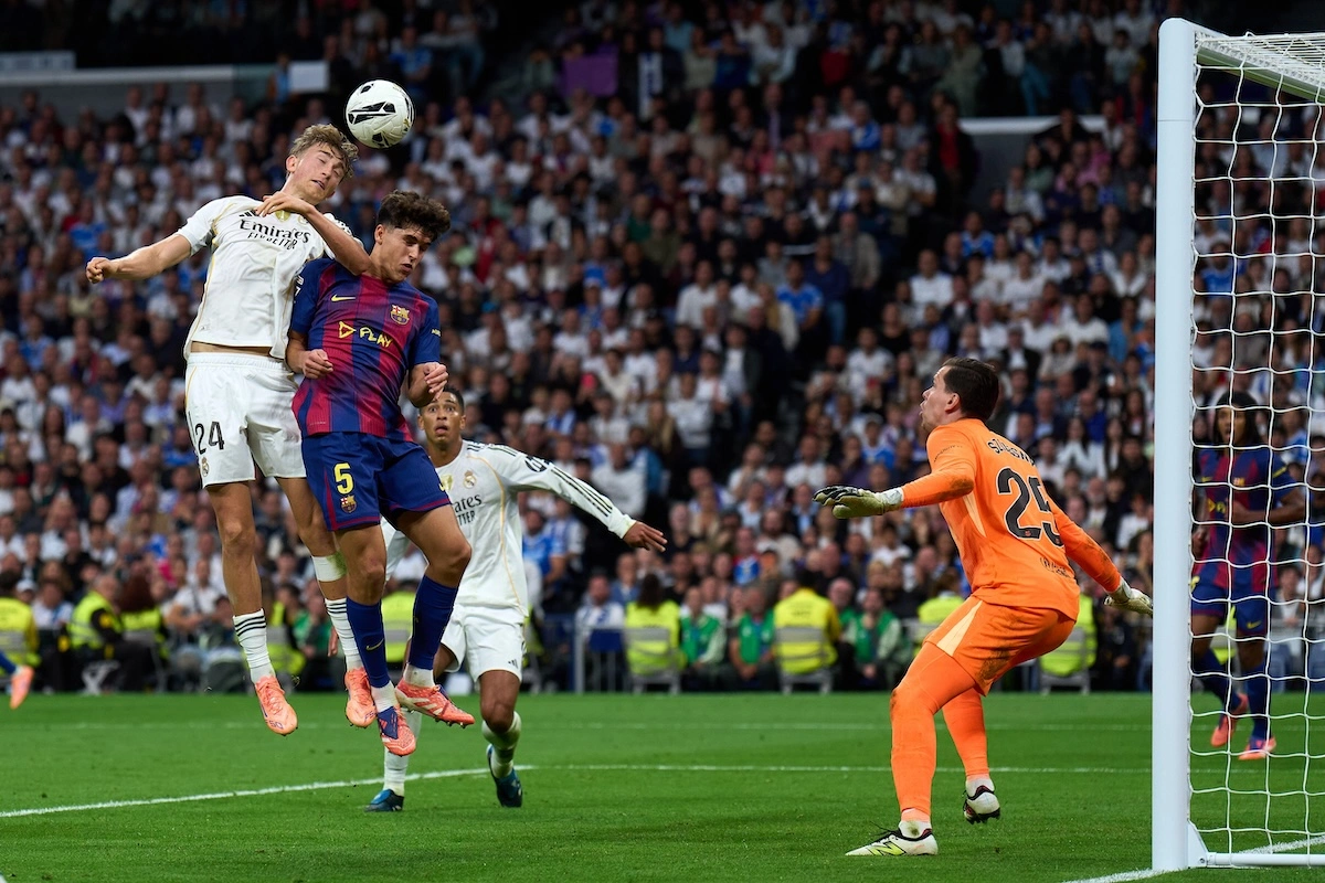 MADRID, SPAIN - OCTOBER 26: Dean Huijsen of Real Madrid battles for the ball with Pau Cubarsí of FC Barcelona during the LaLiga EA Sports match between Real Madrid CF and FC Barcelona at Estadio Santiago Bernabeu on October 26, 2025 in Madrid, Spain. (Photo by Angel Martinez/Getty Images)