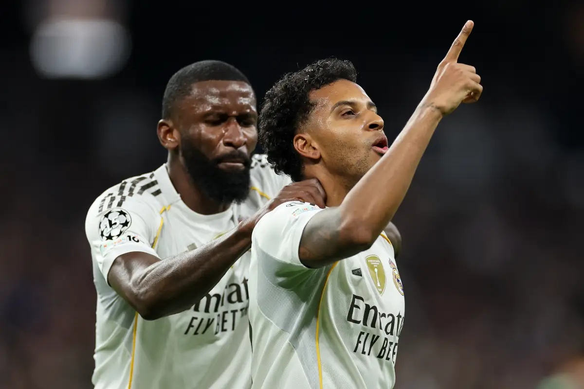 MADRID, SPAIN - DECEMBER 10: Rodrygo of Real Madrid celebrates scoring his team's first goal with his teammate Antonio Ruediger during the UEFA Champions League 2025/26 League Phase MD6 match between Real Madrid C.F. and Manchester City at Estadio Santiago Bernabeu on December 10, 2025 in Madrid, Spain. (Photo by Florencia Tan Jun/Getty Images)