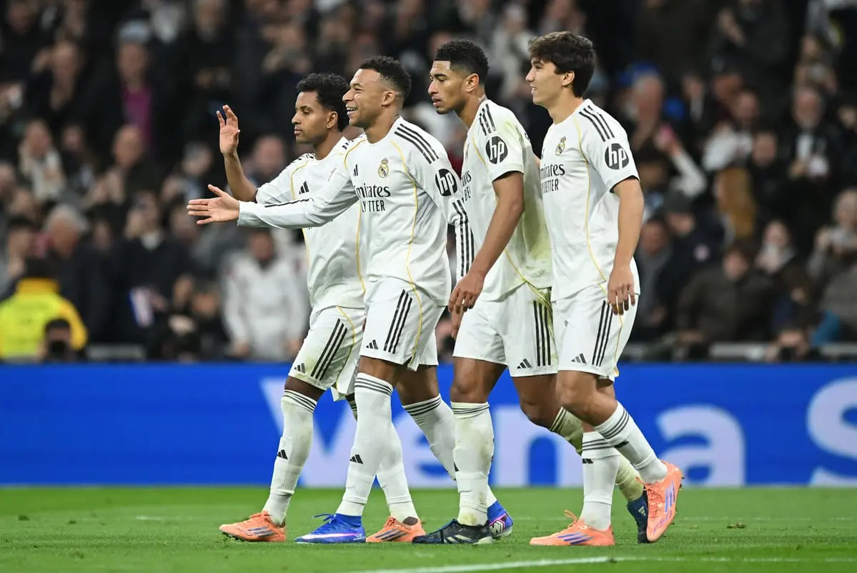 MADRID, SPAIN - DECEMBER 20: Kylian Mbappe of Real Madrid (2L) celebrates scoring his team's second goal with teammates Rodrygo (L) Jude Bellingham (C) and Gonzalo Garcia during the LaLiga EA Sports match between Real Madrid CF and Sevilla FC at Estadio Santiago Bernabeu on December 20, 2025 in Madrid, Spain. (Photo by Denis Doyle/Getty Images).