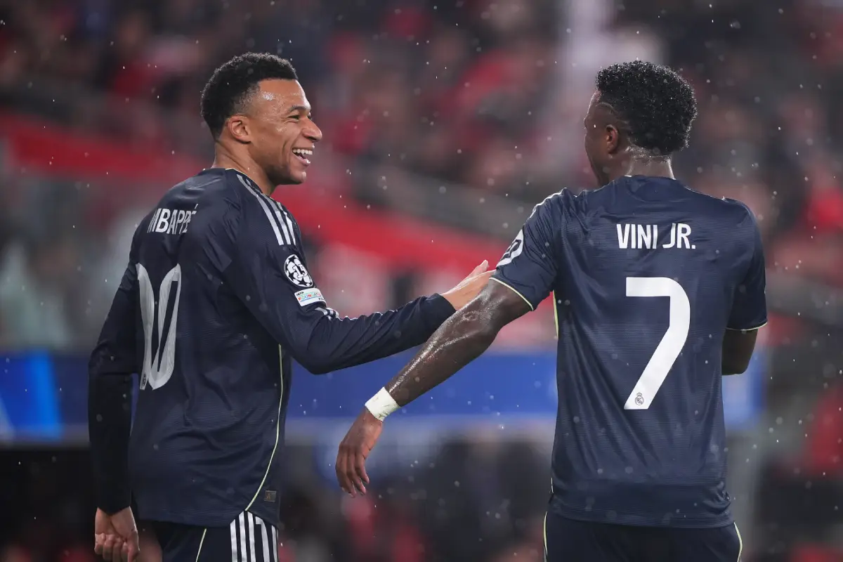 LISBON, PORTUGAL - JANUARY 28: Kylian Mbappe of Real Madrid celebrates scoring his team's first goal with teammate Vinicius Junior during the UEFA Champions League 2025/26 League Phase MD8 match between SL Benfica and Real Madrid C.F. at Estadio do SL Benfica on January 28, 2026 in Lisbon, Portugal. (Photo by Jose Manuel Alvarez Rey/Getty Images)