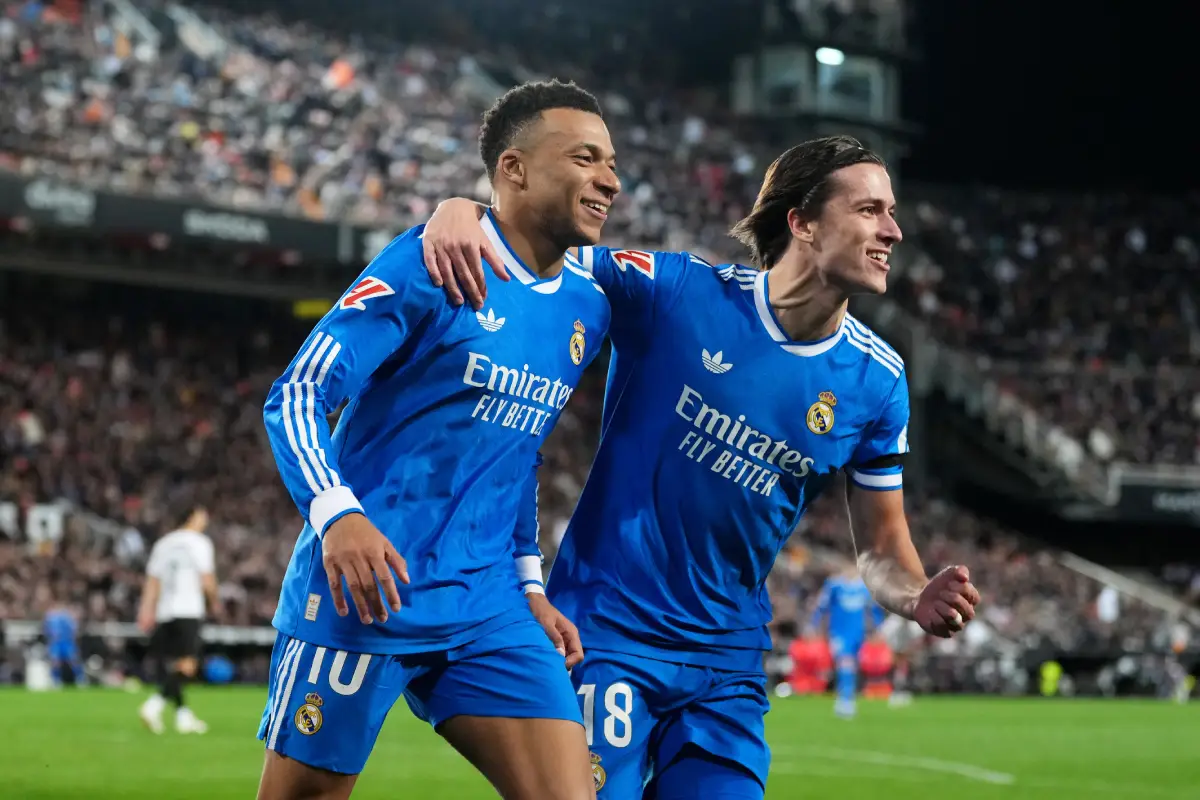 VALENCIA, SPAIN - FEBRUARY 08: Kylian Mbappe of Real Madrid celebrates scoring his team's second goal with Alvaro Carreras during the LaLiga EA Sports match between Valencia CF and Real Madrid CF at Estadi de Mestalla on February 08, 2026 in Valencia, Spain. (Photo by Aitor Alcalde/Getty Images)