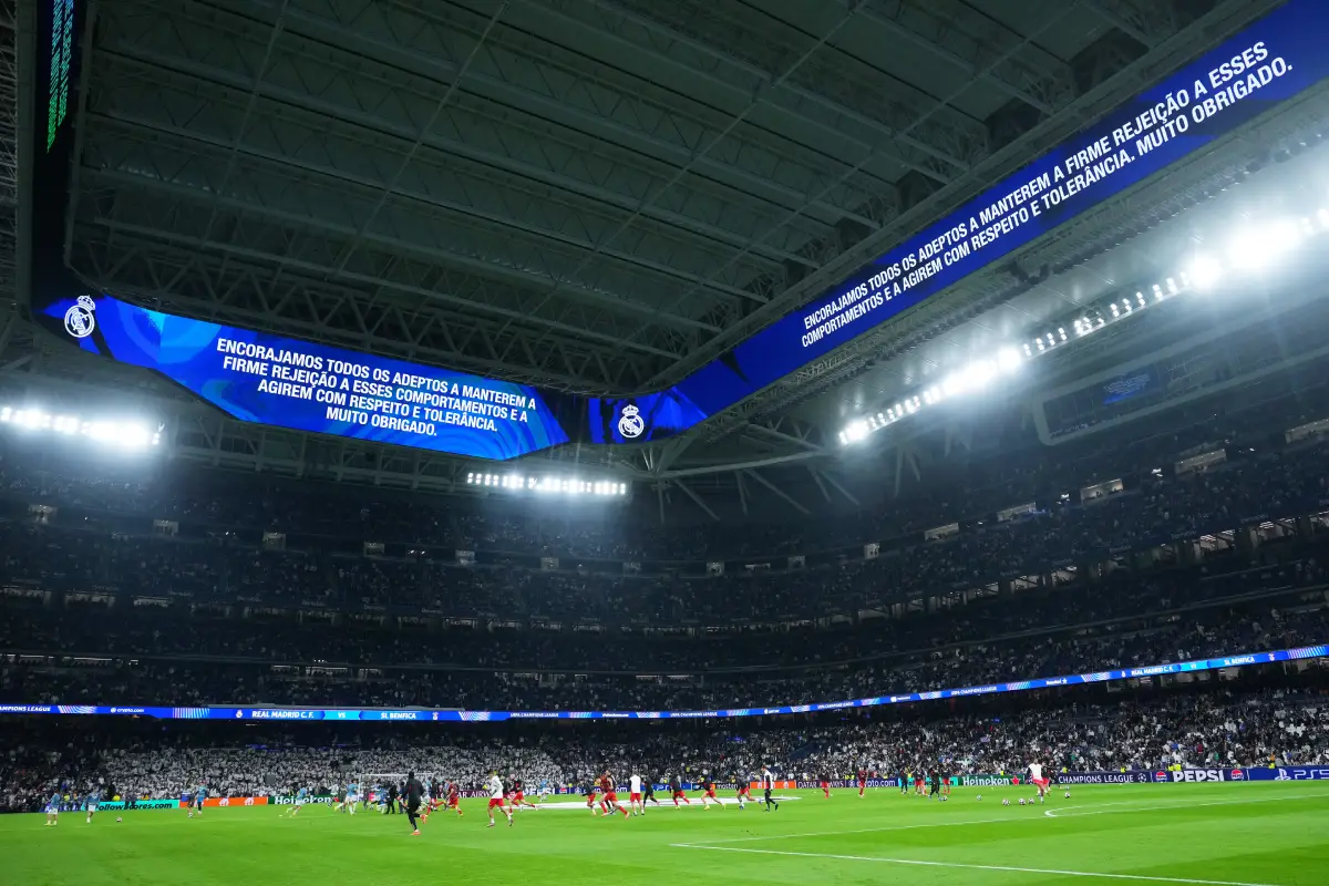 MADRID, SPAIN - FEBRUARY 25: A general view of the inside of the the stadium as the LED Screens display a message in Portuguese which encourages fans to "act with respect and tolerance" prior to the UEFA Champions League 2025/26 League Knockout Play-off Second Leg match between Real Madrid C.F. and SL Benfica at Estadio Santiago Bernabeu on February 25, 2026 in Madrid, Spain. (Photo by Angel Martinez/Getty Images)