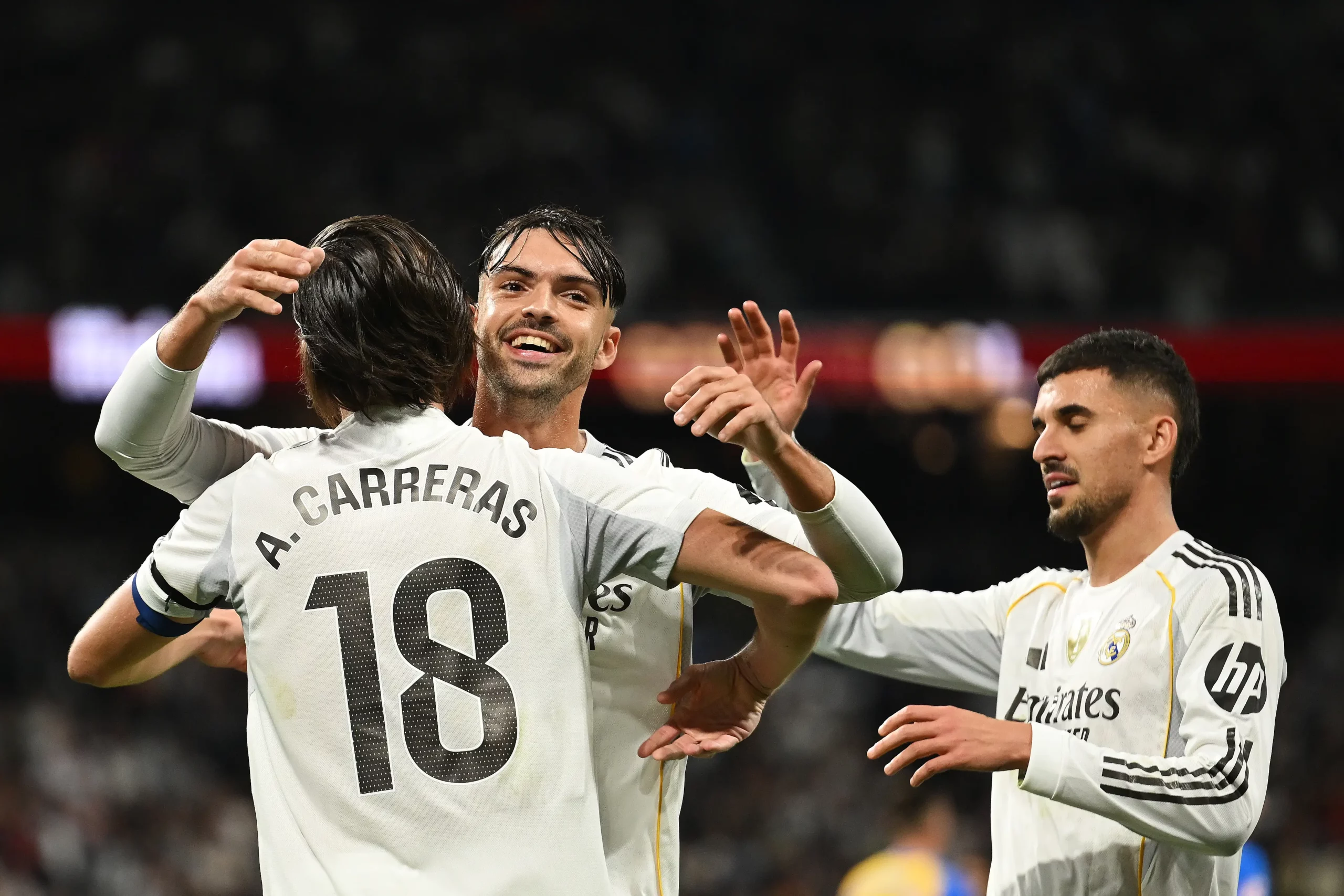 MADRID, SPAIN - NOVEMBER 01: Alvaro Carreras of Real Madrid celebrates scoring his team's fourth goal with teammate Raul Asencio during the LaLiga EA Sports match between Real Madrid CF and Valencia CF at Estadio Santiago Bernabeu on November 01, 2025 in Madrid, Spain. (Photo by Denis Doyle/Getty Images)