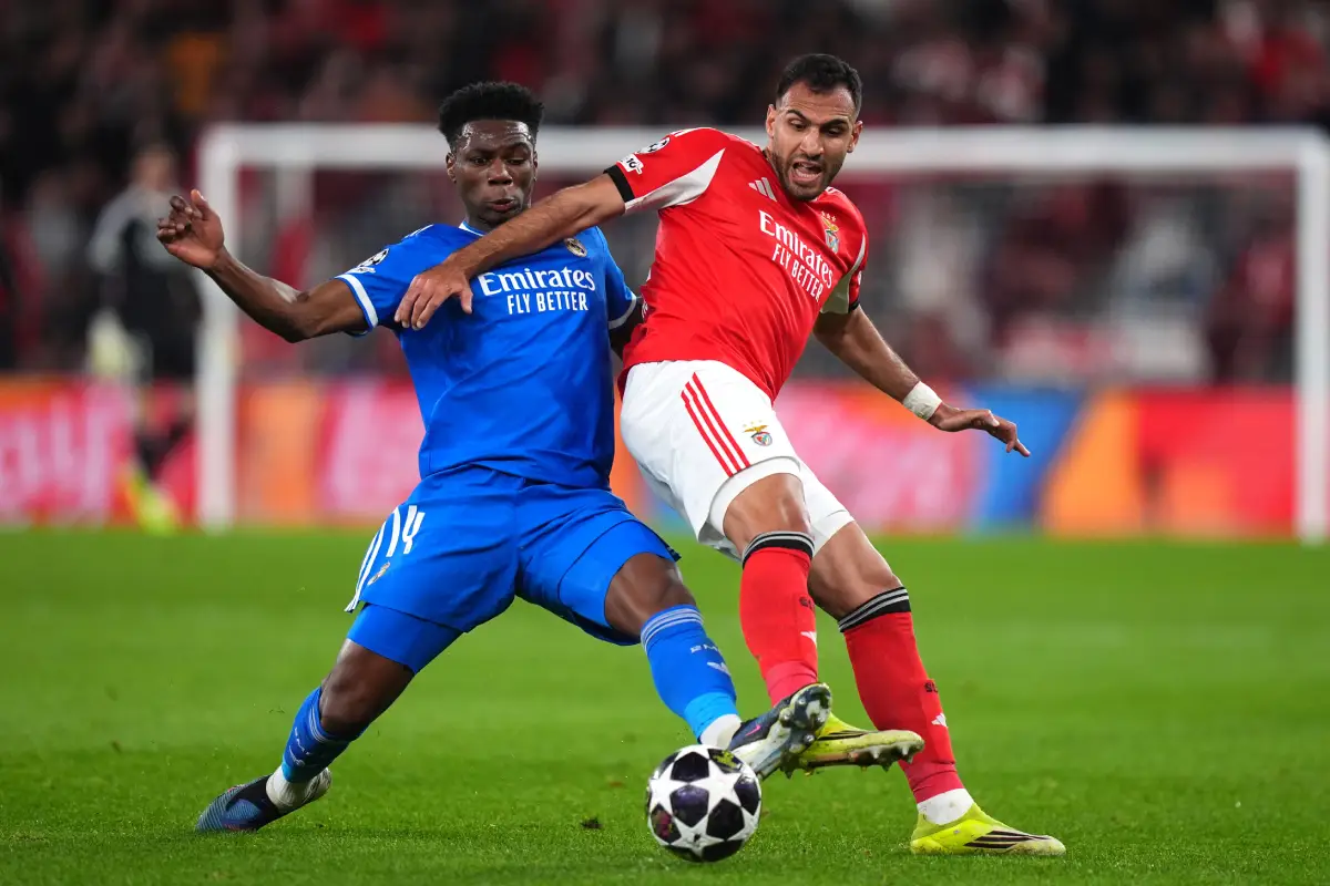 LISBON, PORTUGAL - FEBRUARY 17: Aurelien Tchouameni of Real Madrid battles for possession with Evangelos Pavlidis of Benfica during the UEFA Champions League 2025/26 League Knockout Play-off First Leg match between SL Benfica and Real Madrid C.F. at Estadio do SL Benfica on February 17, 2026 in Lisbon, Portugal. (Photo by Angel Martinez/Getty Images)