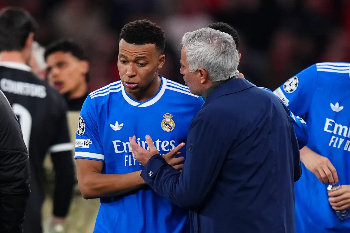 LISBON, PORTUGAL - FEBRUARY 17: Kylian Mbappe of Real Madrid speaks to Jose Mourinho, Head Coach of Benfica, during the UEFA Champions League 2025/26 League Knockout Play-off First Leg match between SL Benfica and Real Madrid C.F. at Estadio do SL Benfica on February 17, 2026 in Lisbon, Portugal. (Photo by Angel Martinez/Getty Images)