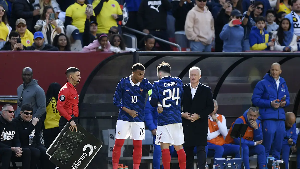 LANDOVER, MARYLAND - MARCH 29: Rayan Cherki of France gives the captain's armband to teammate Kylian Mbappe (Real Madrid) during the international friendly match between Colombia and France at Northwest Stadium on March 29, 2026 in Landover, Maryland. (Photo by Hannah Foslien/Getty Images)
