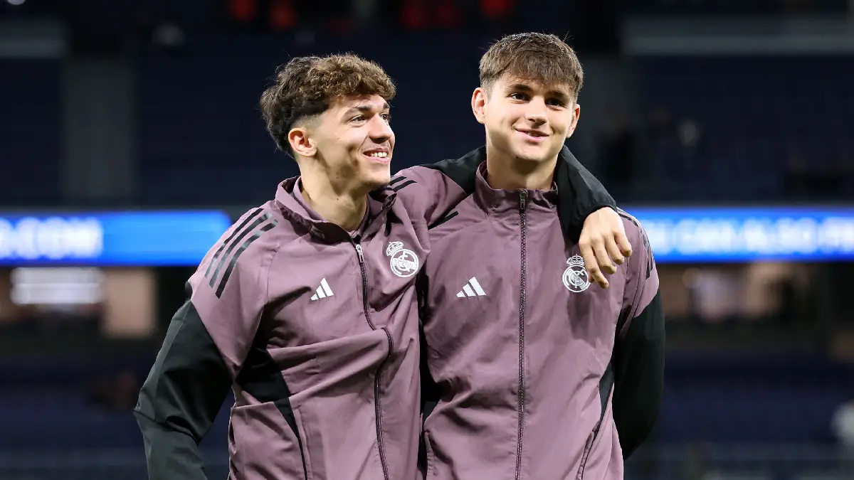 MADRID, SPAIN - MARCH 22: Thiago Pitarch and Diego Aguado of Real Madrid embrace prior to the LaLiga EA Sports match between Real Madrid CF and Atletico de Madrid at Estadio Santiago Bernabeu on March 22, 2026 in Madrid, Spain. (Photo by Florencia Tan Jun/Getty Images)