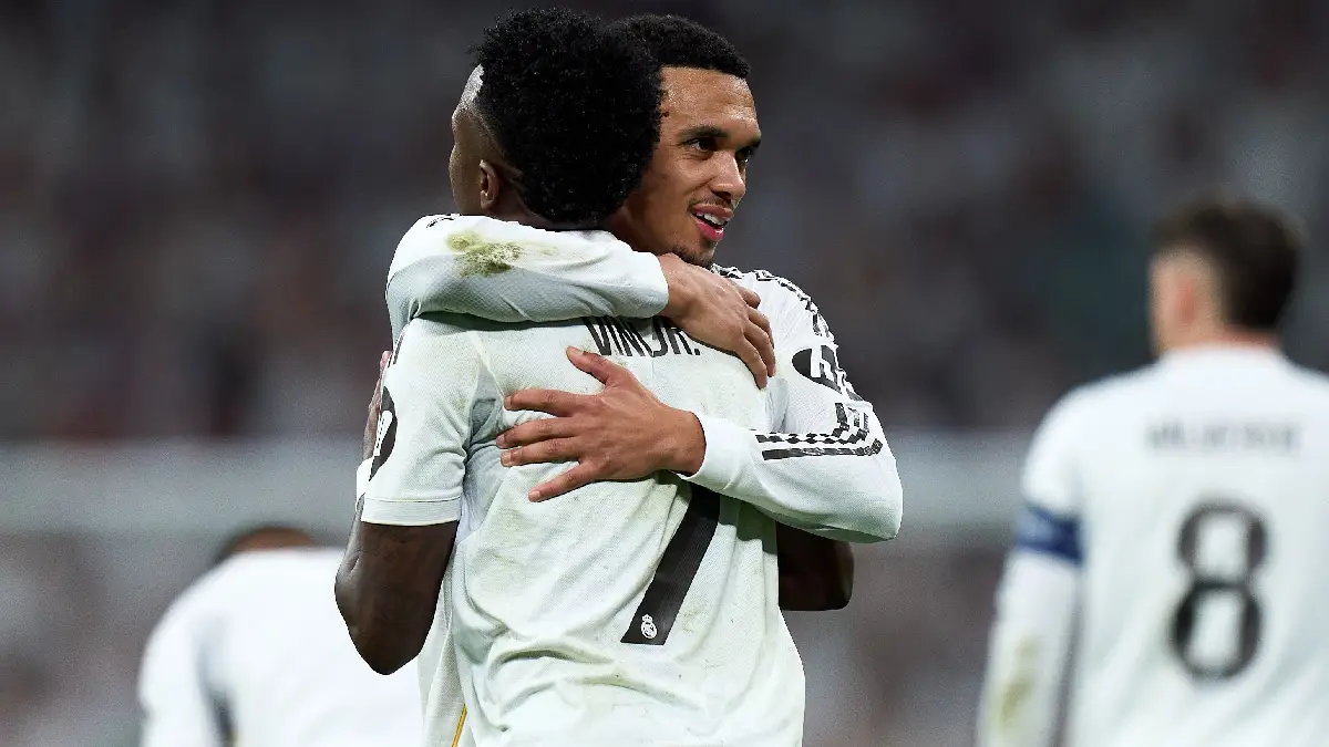 MADRID, SPAIN - FEBRUARY 25: Vinicius Junior of Real Madrid celebrates with Trent Alexander-Arnold scoring the team's second goal during the UEFA Champions League 2025/26 League Knockout Play-off Second Leg match between Real Madrid C.F. and SL Benfica at Estadio Santiago Bernabeu on February 25, 2026 in Madrid, Spain. (Photo by Angel Martinez/Getty Images)