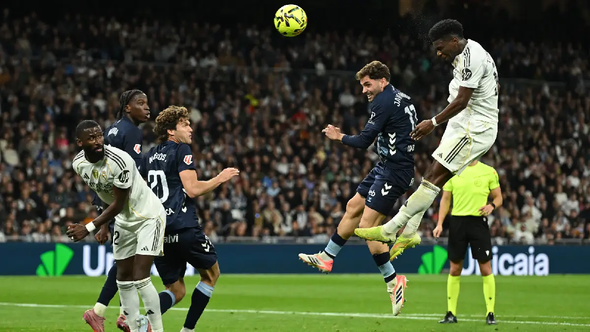 MADRID, SPAIN - DECEMBER 07: Aurelien Tchouameni of Real Madrid heads the ball during the LaLiga EA Sports match between Real Madrid CF and RC Celta de Vigo at Estadio Santiago Bernabeu on December 07, 2025 in Madrid, Spain. (Photo by Denis Doyle/Getty Images)