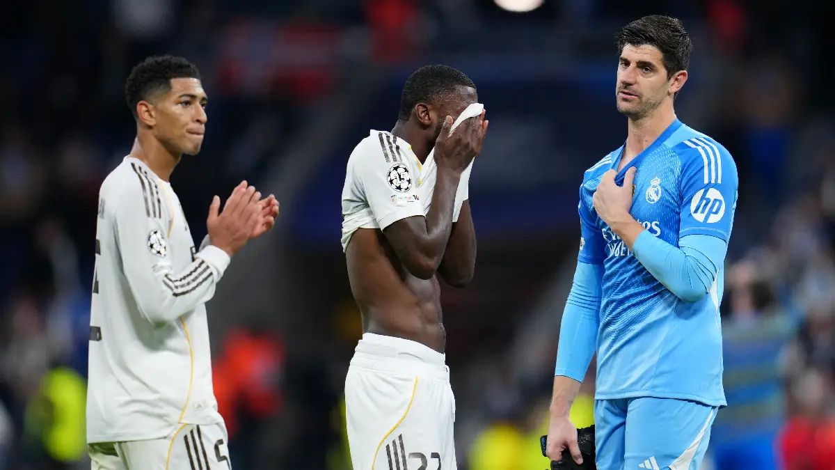 MADRID, SPAIN - DECEMBER 10: Jude Bellingham, Antonio Ruediger and Thibaut Courtois of Real Madrid react following the team's defeat during the UEFA Champions League 2025/26 League Phase MD6 match between Real Madrid C.F. and Manchester City at Estadio Santiago Bernabeu on December 10, 2025 in Madrid, Spain. (Photo by Aitor Alcalde/Getty Images)