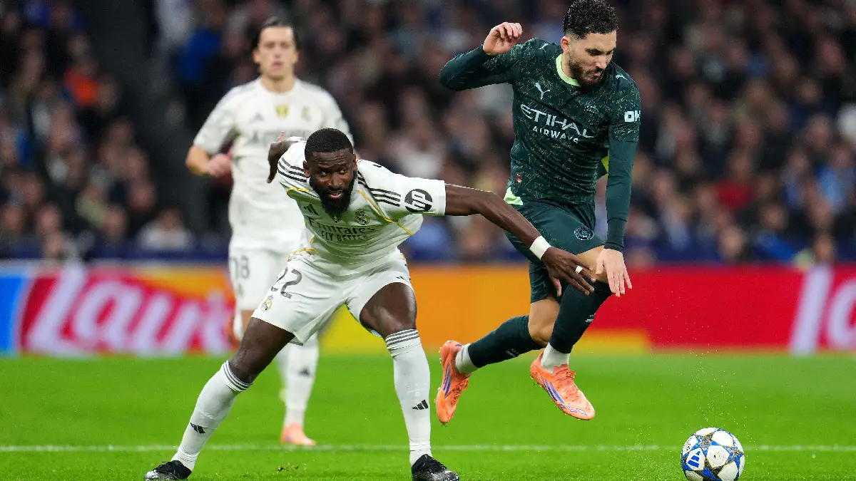 MADRID, SPAIN - DECEMBER 10: Antonio Ruediger of Real Madrid clashes with Rayan Cherki of Manchester City during the UEFA Champions League 2025/26 League Phase MD6 match between Real Madrid C.F. and Manchester City at Estadio Santiago Bernabeu on December 10, 2025 in Madrid, Spain. (Photo by Aitor Alcalde/Getty Images)