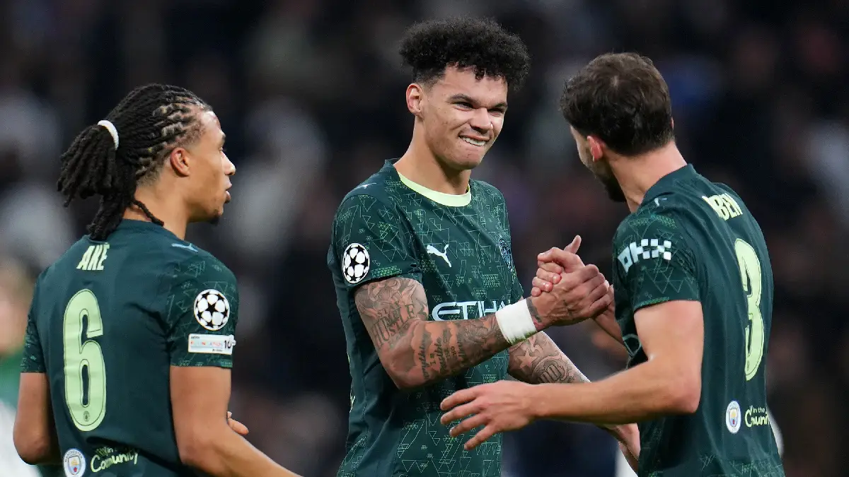 MADRID, SPAIN - DECEMBER 10: Nico O'Reilly of Manchester City celebrates with teammate Ruben Dias following the team's victory during the UEFA Champions League 2025/26 League Phase MD6 match between Real Madrid C.F. and Manchester City at Estadio Santiago Bernabeu on December 10, 2025 in Madrid, Spain. (Photo by Aitor Alcalde/Getty Images)
