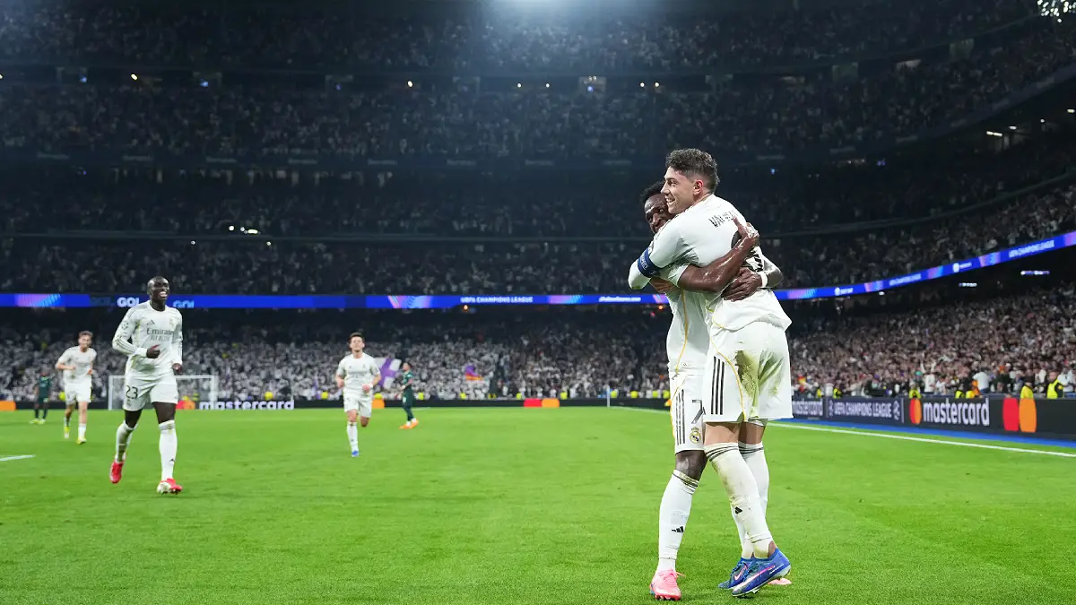 MADRID, SPAIN - MARCH 11: Federico Valverde of Real Madrid celebrates scoring his team's second goal with teammate Vinicius Junior during the UEFA Champions League 2025/26 Round of 16 First Leg match between Real Madrid CF and Manchester City FC at Estadio Santiago Bernabeu on March 11, 2026 in Madrid, Spain. (Photo by Angel Martinez/Getty Images)
