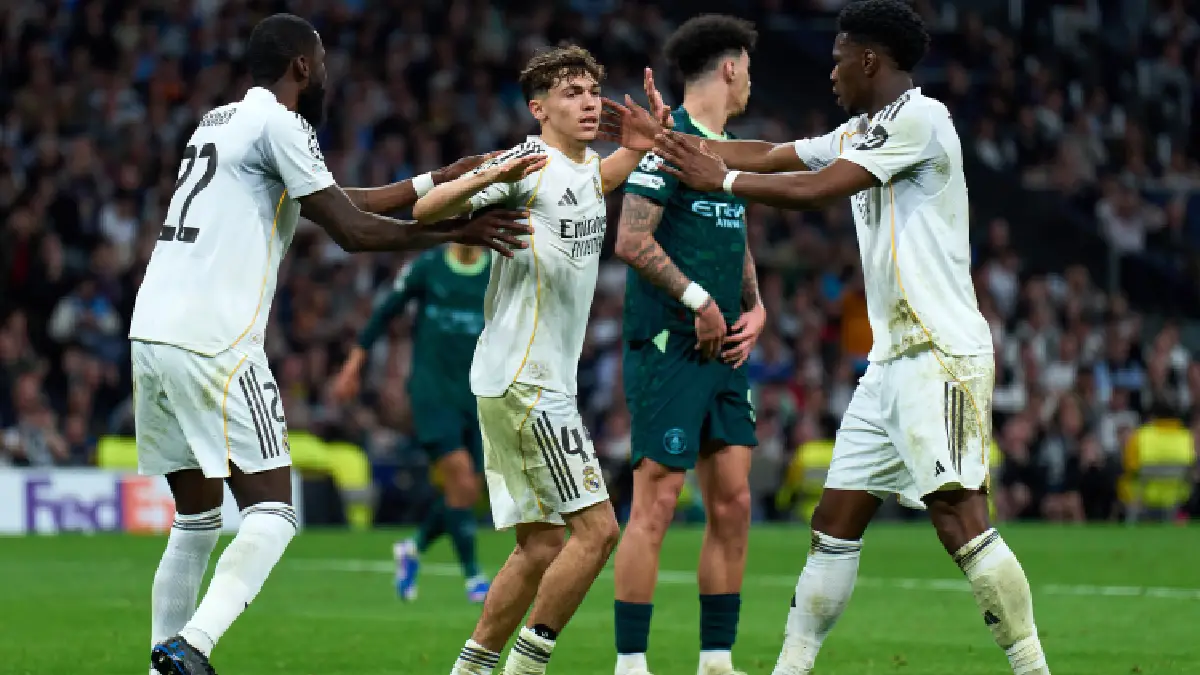 MADRID, SPAIN - MARCH 11: Thiago Pitarch of Real Madrid interacts with Antonio Rudiger and Aurelien Tchouameni during the UEFA Champions League 2025/26 Round of 16 First Leg match between Real Madrid CF and Manchester City FC at Estadio Santiago Bernabeu on March 11, 2026 in Madrid, Spain. (Photo by Angel Martinez/Getty Images)