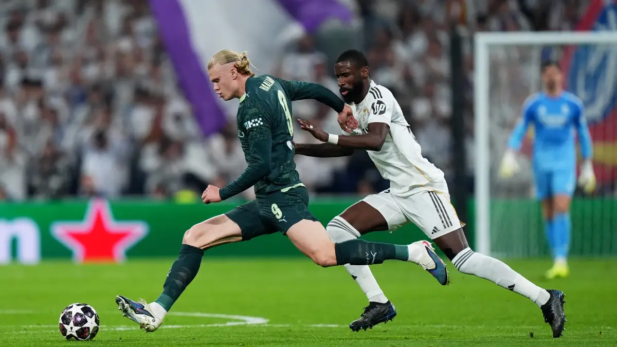 MADRID, SPAIN - MARCH 11: Erling Haaland of Manchester City is challenged by Antonio Ruediger of Real Madrid during the UEFA Champions League 2025/26 Round of 16 First Leg match between Real Madrid CF and Manchester City FC at Estadio Santiago Bernabeu on March 11, 2026 in Madrid, Spain. (Photo by Angel Martinez/Getty Images)