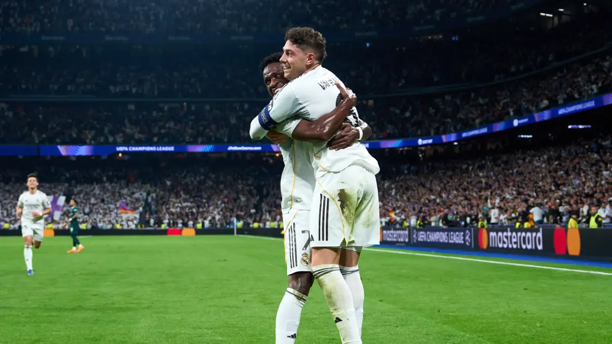 MADRID, SPAIN - MARCH 11: Federico Valverde of Real Madrid celebrates scoring his team's second goal with teammate Vinicius Junior during the UEFA Champions League 2025/26 Round of 16 First Leg match between Real Madrid CF and Manchester City FC at Estadio Santiago Bernabeu on March 11, 2026 in Madrid, Spain. (Photo by Angel Martinez/Getty Images)
