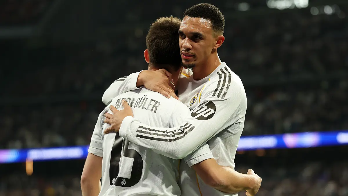 MADRID, SPAIN - FEBRUARY 25: Arda Gueler of Real Madrid celebrates with teammate Trent Alexander-Arnold after scoring a goal that is later ruled offside during the UEFA Champions League 2025/26 League Knockout Play-off Second Leg match between Real Madrid C.F. and SL Benfica at Estadio Santiago Bernabeu on February 25, 2026 in Madrid, Spain. (Photo by Clive Brunskill/Getty Images)