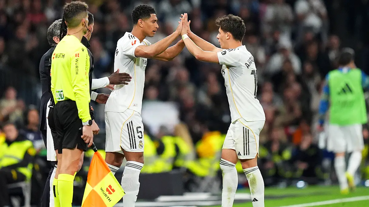 MADRID, SPAIN - MARCH 22: Arda Gueler of Real Madrid reacts with Jude Bellingham as he leaves the pitch after being substituted during the LaLiga EA Sports match between Real Madrid CF and Atletico de Madrid at Estadio Santiago Bernabeu on March 22, 2026 in Madrid, Spain. (Photo by Angel Martinez/Getty Images)