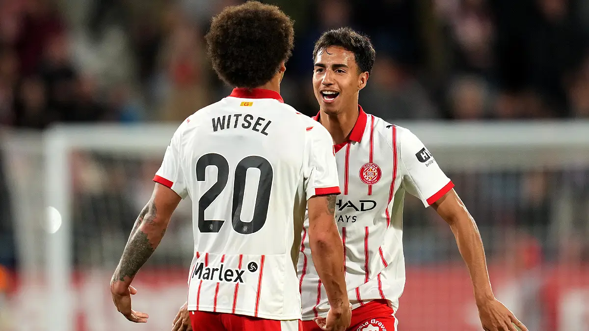 GIRONA, SPAIN - APRIL 06: Vitor Reis of Girona FC celebrates victory with teammate Axel Witsel during the LaLiga EA Sports match between Girona FC and Villarreal CF at Montilivi Stadium on April 06, 2026 in Girona, Spain. (Photo by Alex Caparros/Getty Images)