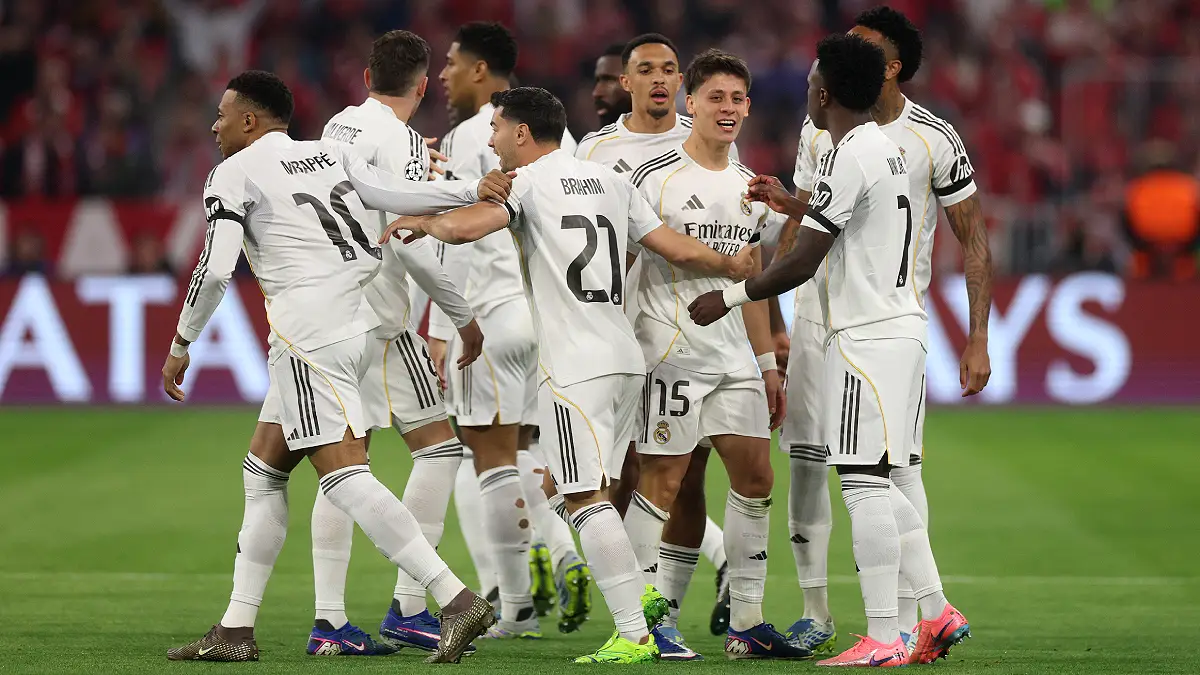 MUNICH, GERMANY - APRIL 15: Arda Gueler of Real Madrid celebrates scoring his team's first goal with teammates during the UEFA Champions League 2025/26 Quarter-Final Second Leg match between FC Bayern München and Real Madrid CF at Football Arena Munich on April 15, 2026 in Munich, Germany. (Photo by Adam Pretty/Getty Images)