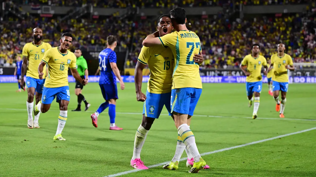 ORLANDO, FLORIDA - MARCH 31: Gabriel Martinelli of Brazil celebrates with teammate Endrick after scoring his team's third goal during the international friendly match between Brazil and Croatia at Camping World Stadium on March 31, 2026 in Orlando, Florida. (Photo by Julio Aguilar/Getty Images)