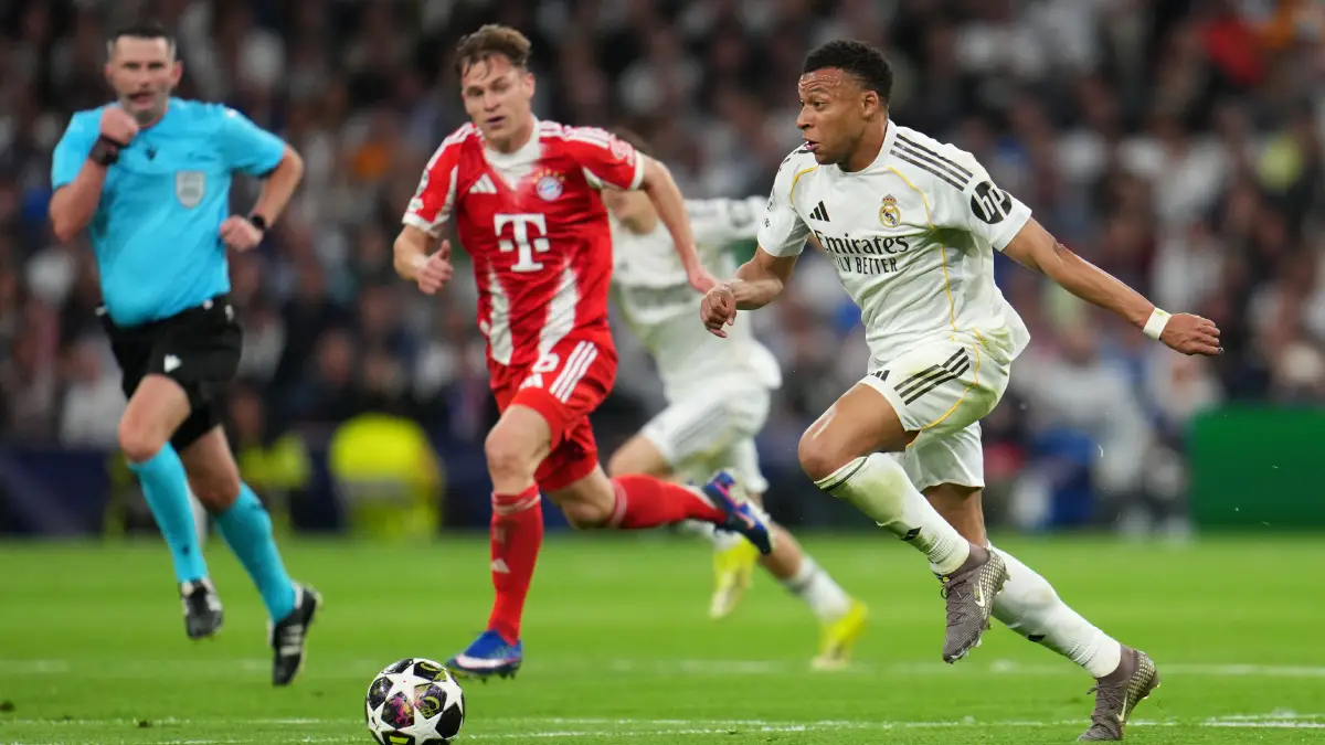MADRID, SPAIN - APRIL 07: Kylian Mbappe of Real Madrid runs with the ball during the UEFA Champions League 2025/26 Quarter-Final First Leg match between Real Madrid CF and FC Bayern München at Estadio Santiago Bernabeu on April 07, 2026 in Madrid, Spain. (Photo by Aitor Alcalde/Getty Images)