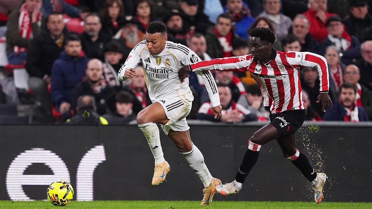 BILBAO, SPAIN - DECEMBER 03: Kylian Mbappe of Real Madrid is challenged by Adama Boiro of Athletic Club during the LaLiga EA Sports match between Athletic Club and Real Madrid CF at Estadio de San Mames on December 03, 2025 in Bilbao, Spain. (Photo by Juan Manuel Serrano Arce/Getty Images)
