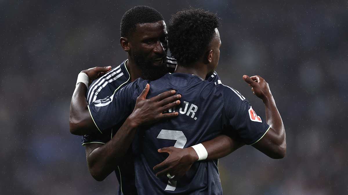 BARCELONA, SPAIN - MAY 03: Vinicius Junior of Real Madrid celebrates scoring his team's first goal with teammate Antonio Ruediger during the LaLiga EA Sports match between RCD Espanyol de Barcelona and Real Madrid CF at RCDE Stadium on May 03, 2026 in Barcelona, Spain. (Photo by Judit Cartiel/Getty Images)