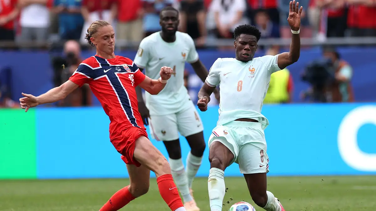 FOXBOROUGH, MASSACHUSETTS - JUNE 26: Thelo Aasgaard #19 of Norway competes for the ball against Aurelien Tchouameni #8 of France , Real Madrid player, during the FIFA World Cup 2026 Group I match between Norway and France at Boston Stadium on June 26, 2026 in Foxborough, Massachusetts. (Photo by Mattia Ozbot/Getty Images)