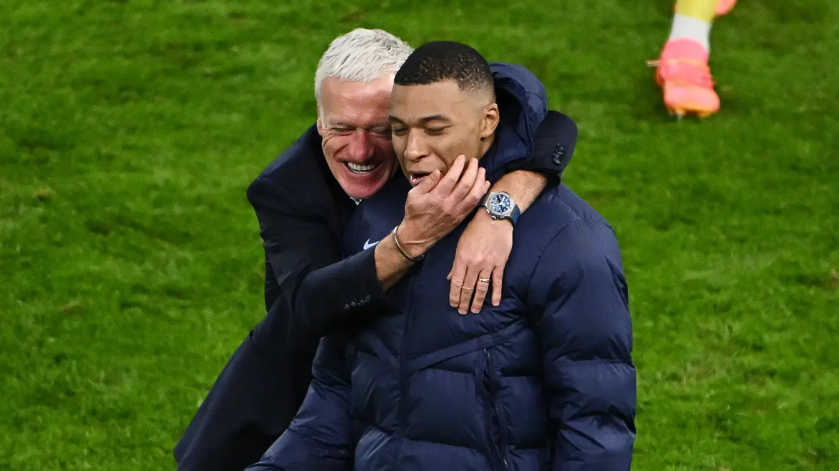 HAMBURG, GERMANY - JULY 05: Didier Deschamps, Head Coach of France, celebrates following the team's victory in the penalty shoot out with Kylian Mbappe of France after the UEFA EURO 2024 quarter-final match between Portugal and France at Volksparkstadion on July 05, 2024 in Hamburg, Germany. (Photo by Dan Mullan/Getty Images)