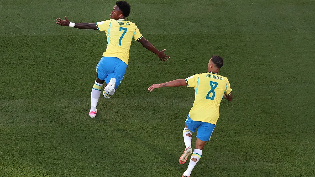 EAST RUTHERFORD, NEW JERSEY - JUNE 13: Vinicius Junior #7 of Brazil celebrates with Bruno Guimaraes #8 after scoring the team's first goal during the FIFA World Cup 2026 Group C match between Brazil and Morocco at New York New Jersey Stadium on June 13, 2026 in East Rutherford, New Jersey. (Photo by Al Bello/Getty Images)