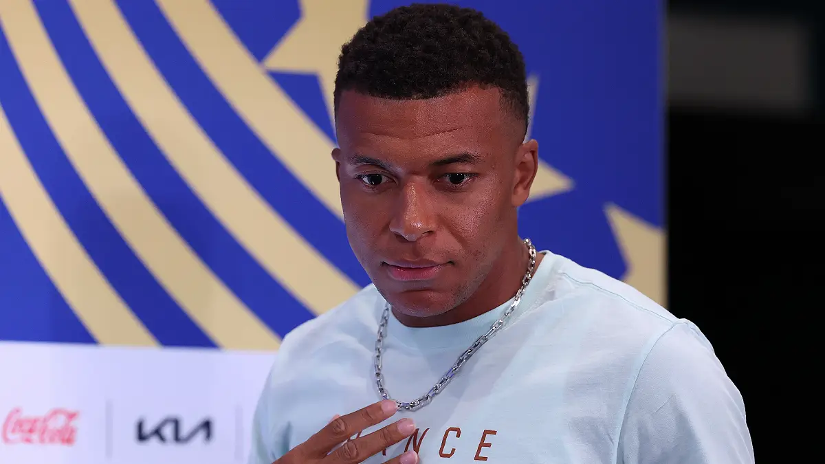 PHILADELPHIA, PENNSYLVANIA - JUNE 21: Kylian Mbappé #10 of France walks in to speak to the media during the team's press conference one day ahead of the FIFA World Cup 2026 Group I match between France and Iraq at Philadelphia Stadium on June 21, 2026 in Philadelphia, Pennsylvania. (Photo by Kevin C. Cox/Getty Images)