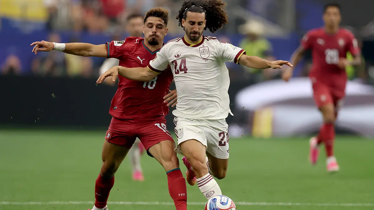 ARLINGTON, TEXAS - JULY 06: Marc Cucurella #24 of Spain is challenged by Pedro Neto #18 of Portugal during the FIFA World Cup 2026 Round Of 16 match between Portugal and Spain at Dallas Stadium on July 06, 2026 in Arlington, Texas. (Photo by Lars Baron/Getty Images)
